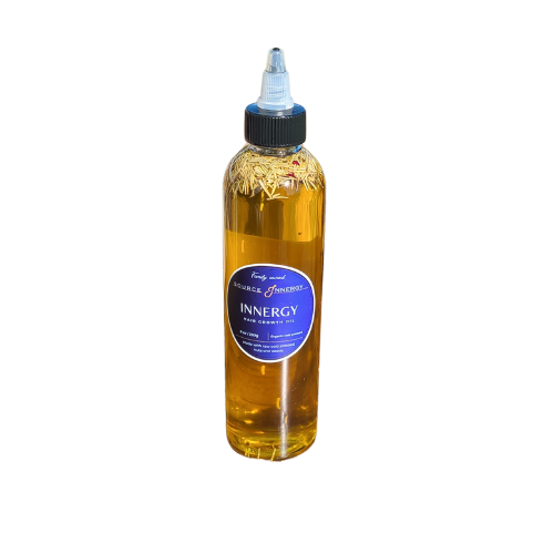"Source Innergy golden raw natural hair growth oil close-up—organic, unscented, chemical-free formula crafted from seeds, nuts, and herbs to restore strength, hydration, and shine to damaged, brittle, and over-processed hair."